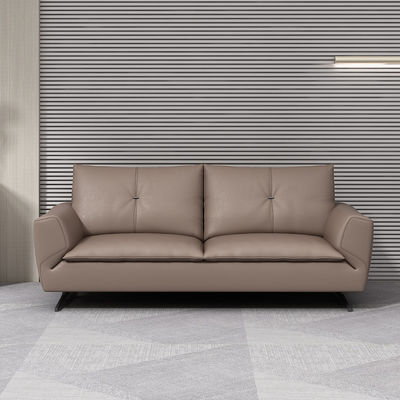 Sofa van grijs leer voor de montage van kantoormeubilair